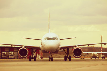 Airplane is taxing at the airport の写真素材