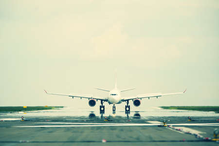 Airplane is landing on the airport の写真素材