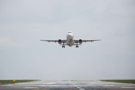 Airplane is landing on the airport の写真素材