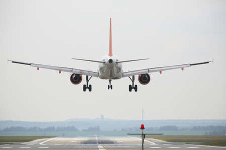 Airplane is landing on the airportの写真素材