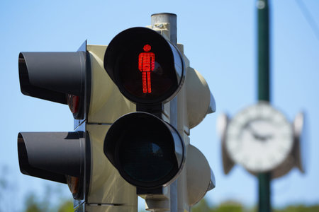 Traffic light with red sign for walkers to stop の写真素材