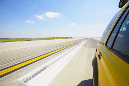 Airfield - safety car on the runway - blurred motionの写真素材