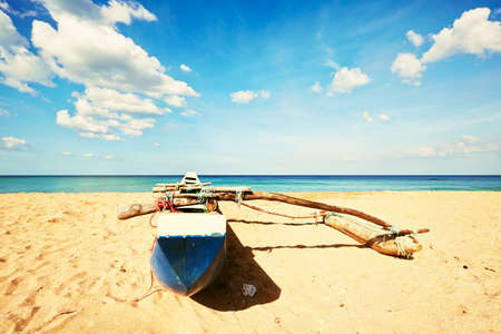 Fishing boat on the beach of Sri Lankaの写真素材