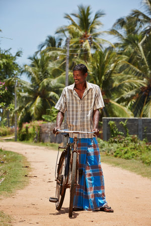 Man with old bicycle in a village in Sri Lanka の写真素材