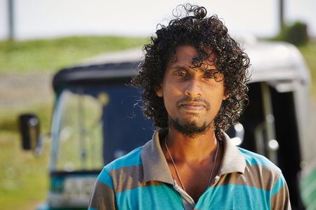 Young tuk-tuk driver in Sri Lanka.の写真素材