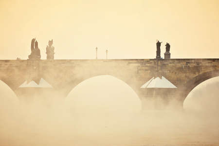 Charles bridge in morning fog, Prague, Czech Republicの写真素材