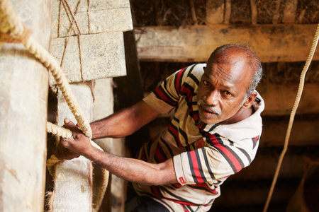MEETIYAGODA, SRI LANKA - SEPTEMBER 7  The worker climbs down into the moonstone mine on September 7, 2013 in Meetiyagoda  Moonstone is one of the gems found in Sri Lanka のeditorial素材