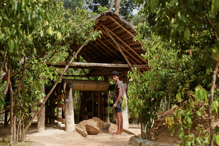 MEETIYAGODA, SRI LANKA - SEPTEMBER 7  Worker is gathering excavated materials to search gemstone in moonstone mine on September 7, 2013 in Meetiyagoda  Moonstone is one of the gems found in Sri Lanka のeditorial素材