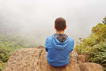 Young man at the end of the road の写真素材