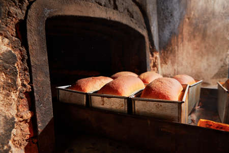 Traditional preparation of bread in the bakery.の写真素材
