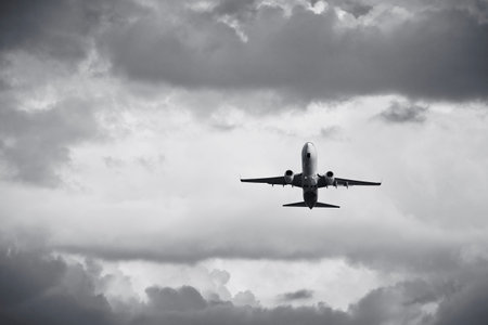 Airplane is flying in the bad weather.