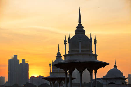 Towers of the historical building railway station in Kuala Lumpur at sunrise.の写真素材