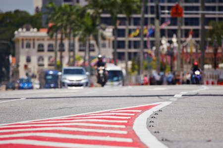 Red and white sign on the street (Kuala Lumpur, Malaysia) - selective focusの写真素材