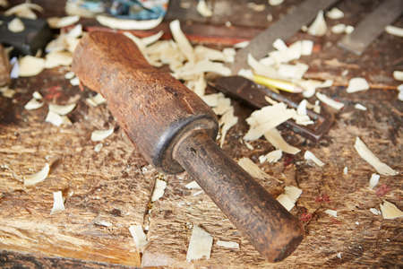 Wooden hammer in old carpentry workshop - selective focusの写真素材