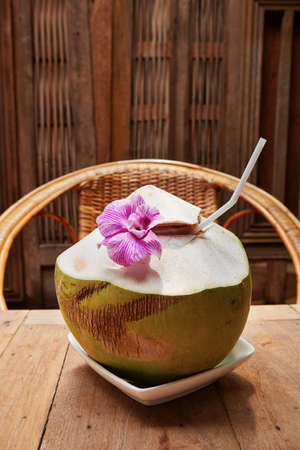 Tropical coconut drink with flower - Thailandの写真素材