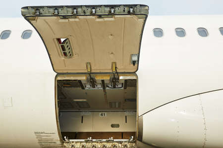 Open cargo door of the commercial airplaneの写真素材