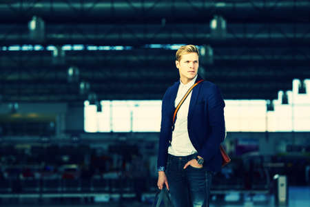 Young businessman is waiting at the airportの写真素材