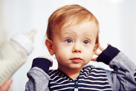 Cheerful little boy after feeding - selective focus