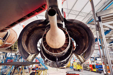 Engine of the airplane under heavy maintenanceの写真素材