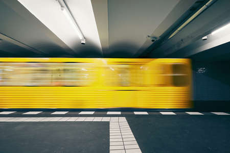 Traffic in subway. Blurred motion of the train in underground station of subway. Berlin, Germanyのeditorial素材