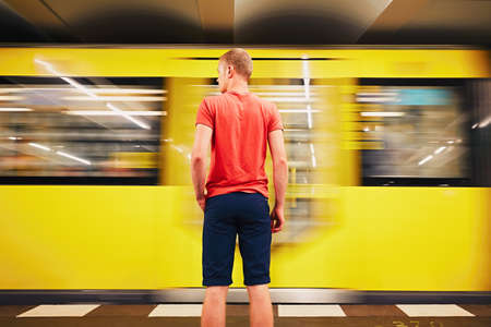 Traffic in subway. Young man is waiting for subway. Berlin, Germanyのeditorial素材