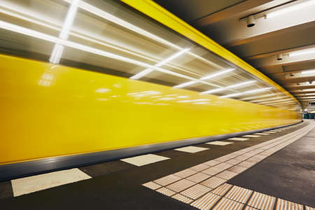 Traffic in subway. Blurred motion of the train in underground station of subway. Berlin, Germanyのeditorial素材