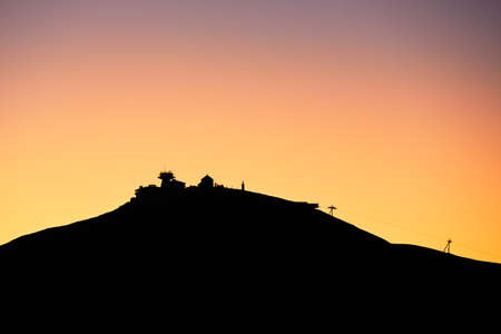 Amazing sunrise in the mounatins. Silhouette of the Snezka - the highest mountain in the Czech Republic.の写真素材