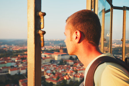 Young tourist looking on the historical part of Prague Capital, Czech Republic