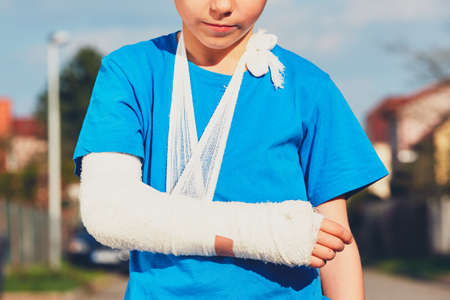 Little boy with broken hand injured after accidentの写真素材