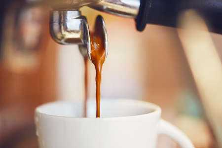 Detail of a coffee machine. Preparation of the espresso in coffee shop.の写真素材