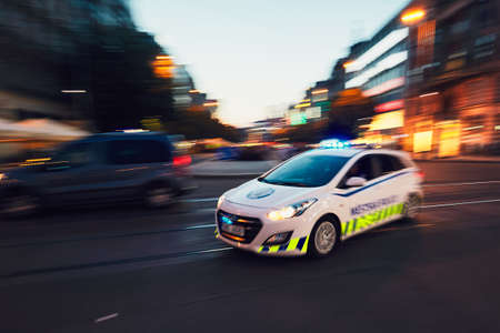 PRAGUE, CZECH REPUBLIC - JUNE 27, 2017: The patrol of Municipal Police of the City of Prague (in blurred motion) respond to an emergency call on June 27, 2017.のeditorial素材