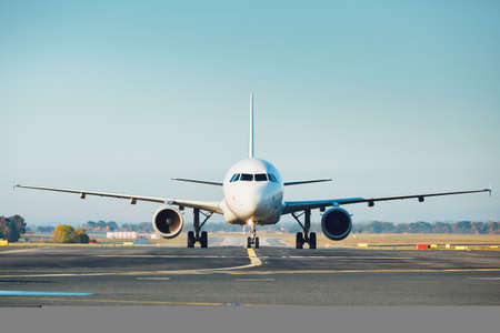 Traffic at the airport. Airplane is taxiing to the runway.