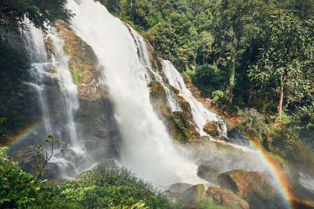 Amazing waterfall with rainbow in tropical rainforest near Chiang Mai, Thailand, の写真素材