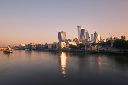 View of riverbank Thames River against skyscrapers. Urban skyline of London at morning light ,...