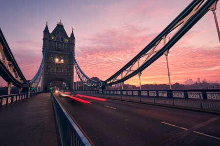 Traffic on Tower Bridge at beautiful dawn. Urban skyline of London, United Kingdom.の写真素材