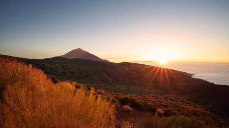Landscape with volcano Pico de Teide above clouds at beautiful sunset. Tenerife, Canary Islands, Spain.の写真素材