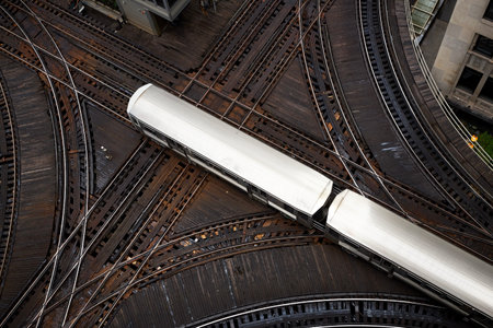 High angle view of passenger train on junction. Elevated railroad track in Chicago downtown.の写真素材