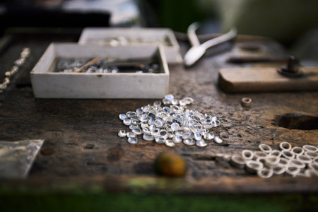 Pile of processed Moonstones ready for jewelry making on work table. Still life wth gemstones in workshop in Sri Lanka.の写真素材