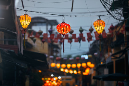 Traditional lanterns hanging on old street in Hoi An in Vietnam. Night life in ancient town.の写真素材