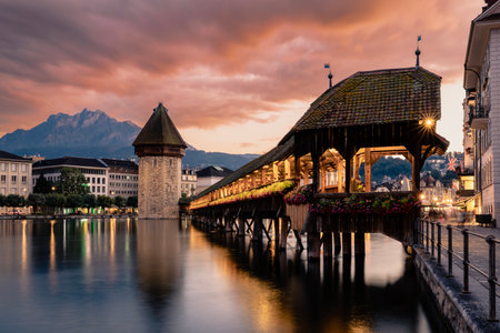 Chapel Bridge is oldest covered bridge in Europe. Historic landmark against Mount Pilatus in Lucerne in Switzerland.の写真素材