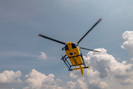 Flying yellow helicopter of emergency medical service. Themes rescue, help and hope.の写真素材