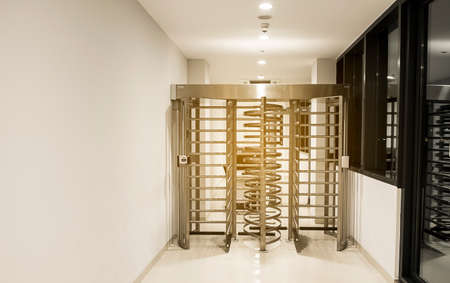 A revolving door to the parking lot of the building.の写真素材