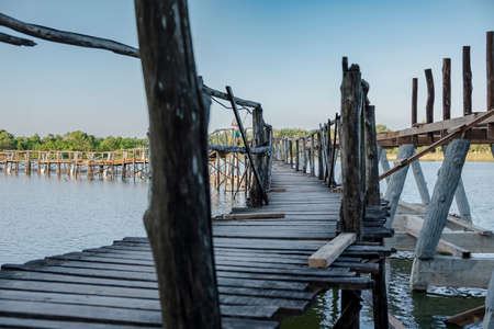 Wooden bridge is under construction. Used to walk in the lake.の写真素材