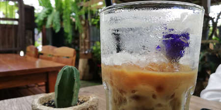 Cold coffee is half eaten.の写真素材