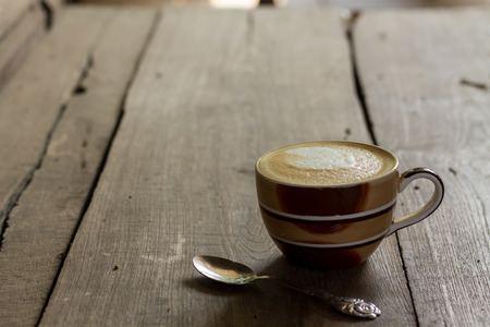 Coffee cup on the table, latte artの写真素材