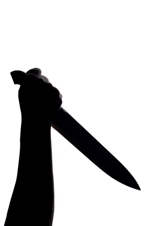 hand with killing kitchen knife silhouette (shadow) on white background.の写真素材