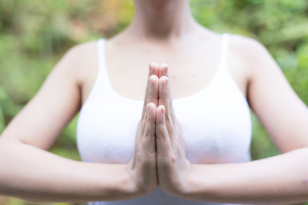 Young woman asia meditates while practicing yoga relax in nature の写真素材
