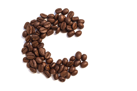 C from coffee beansisolated on a white backgroundの写真素材