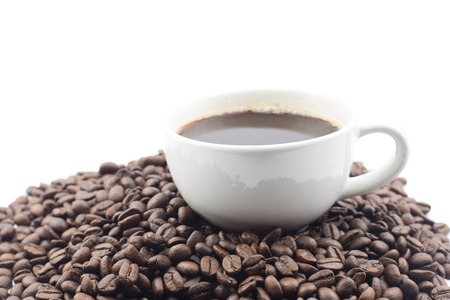 Coffee cup and beans on a white background.の写真素材