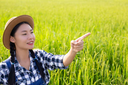 happy farmer raising his fingerの写真素材